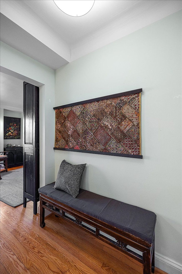 sitting room with hardwood / wood-style flooring