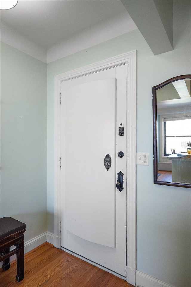 doorway with hardwood / wood-style flooring