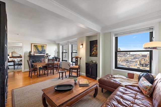 living room featuring a healthy amount of sunlight, ornamental molding, and hardwood / wood-style flooring