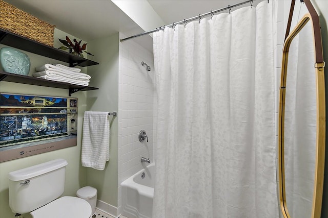 bathroom with toilet and shower / tub combo