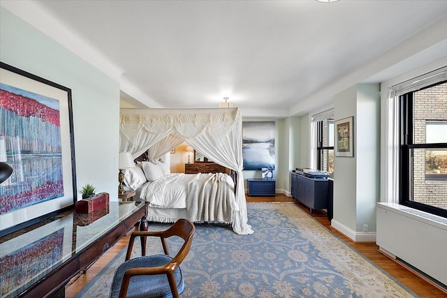 bedroom with hardwood / wood-style flooring