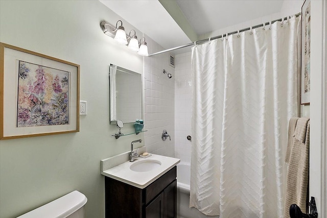 full bathroom with toilet, vanity, and shower / tub combo with curtain