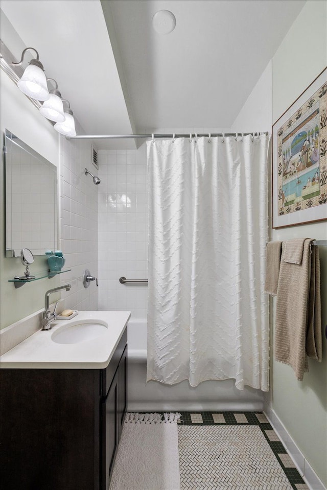 bathroom featuring shower / bathtub combination with curtain and vanity