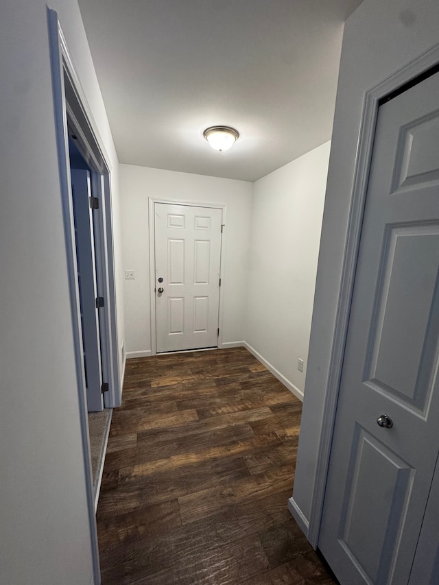 corridor featuring dark hardwood / wood-style floors