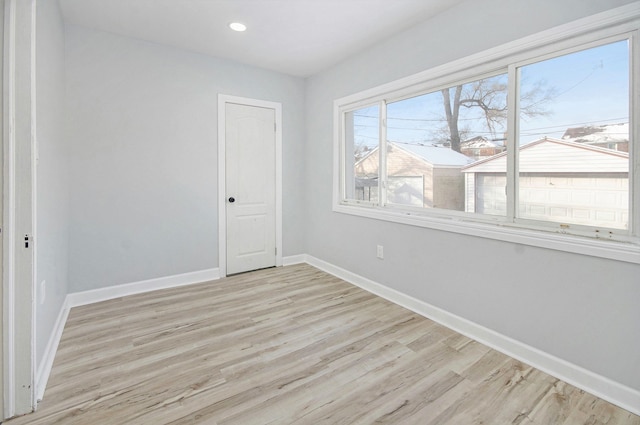 spare room with light hardwood / wood-style floors