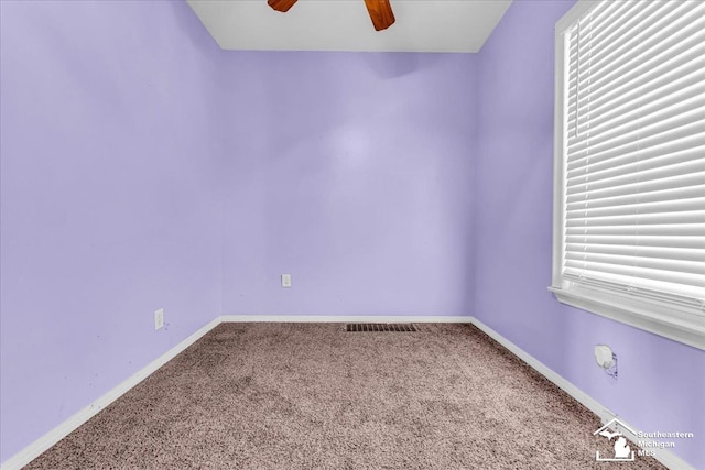 unfurnished room with carpet floors and ceiling fan