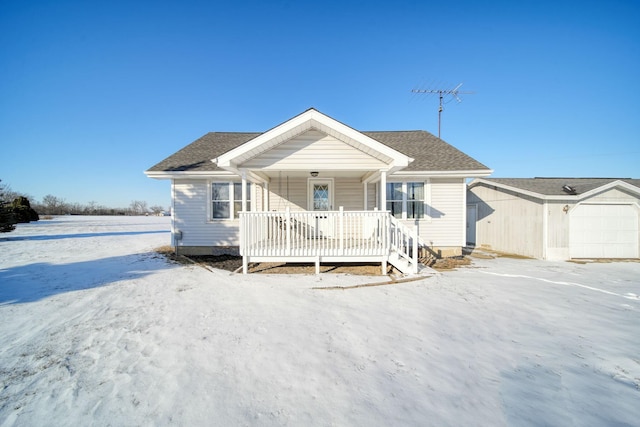 view of front of house with covered porch and a garage