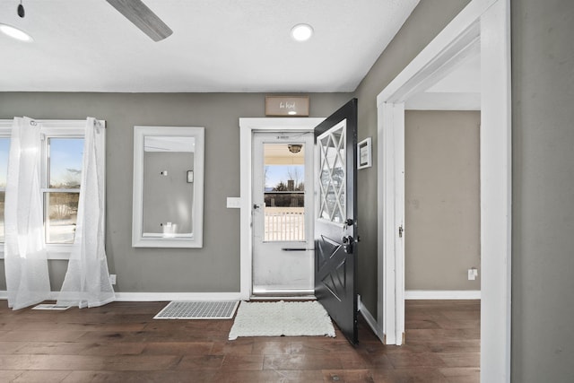 entryway with dark hardwood / wood-style floors