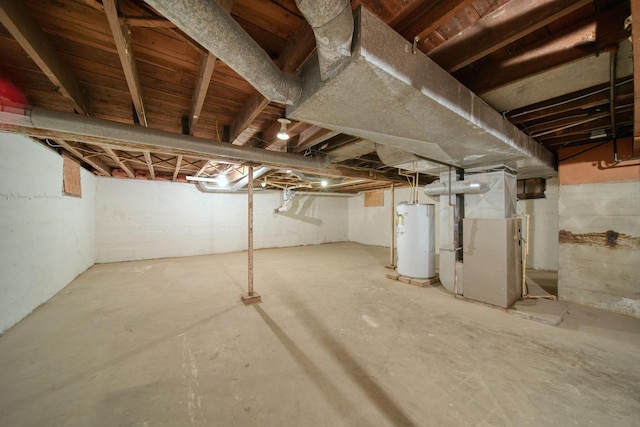 basement featuring heating unit and gas water heater