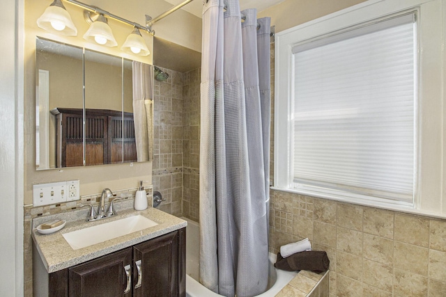 bathroom featuring vanity and shower / bath combination with curtain