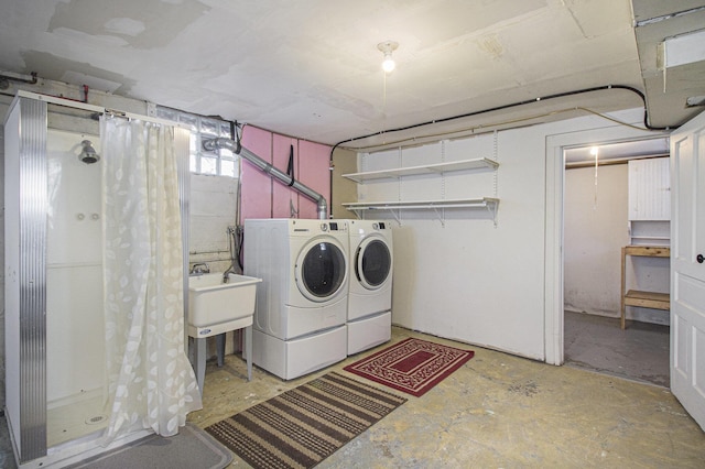 laundry room featuring washing machine and clothes dryer