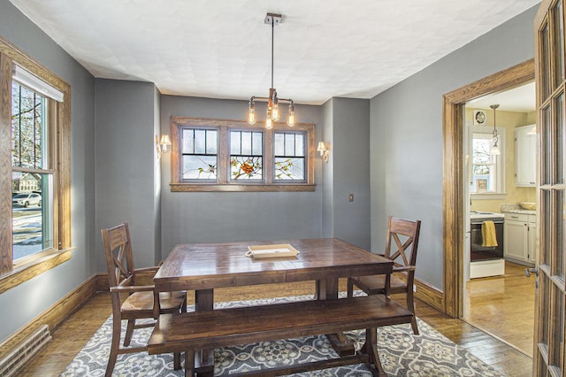 dining area with light hardwood / wood-style floors