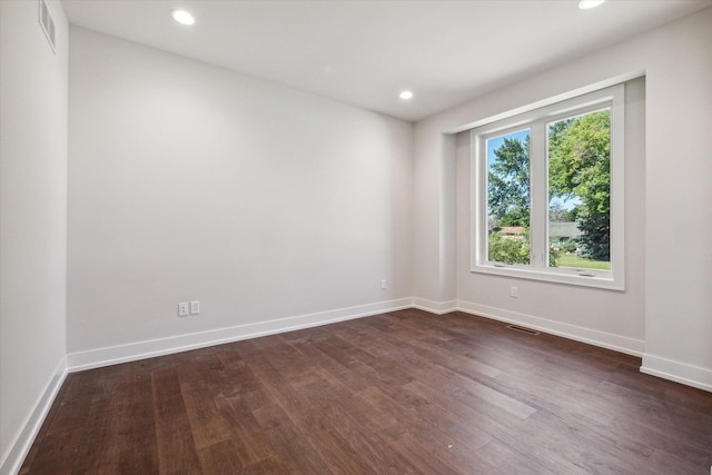 empty room featuring dark wood-type flooring