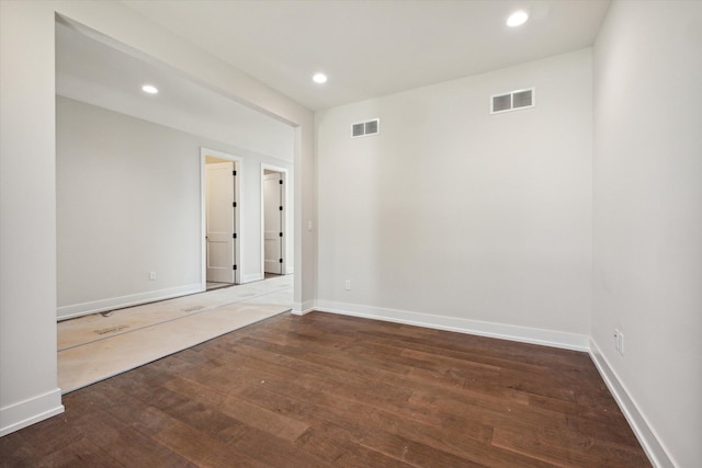 spare room with dark hardwood / wood-style flooring