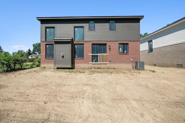 back of house with central air condition unit