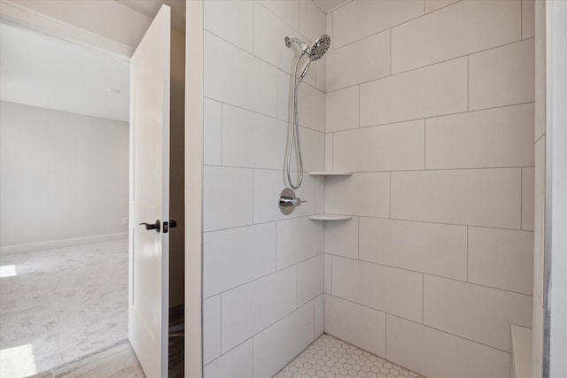 bathroom with tiled shower