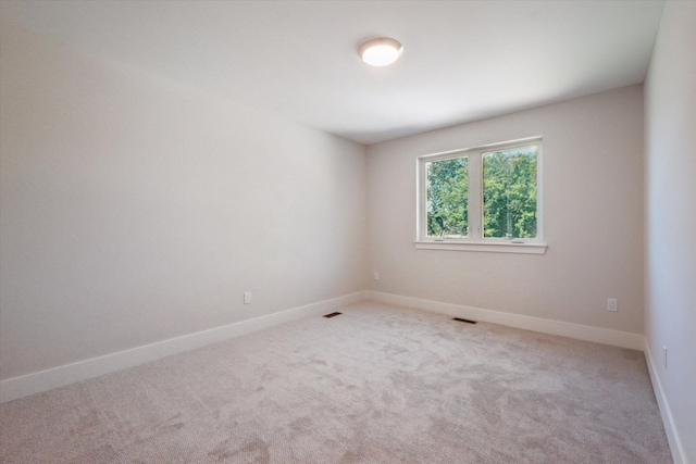 spare room featuring carpet flooring