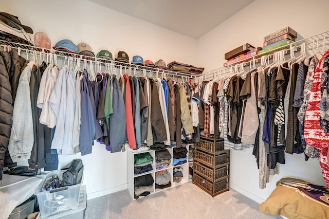 spacious closet with carpet flooring