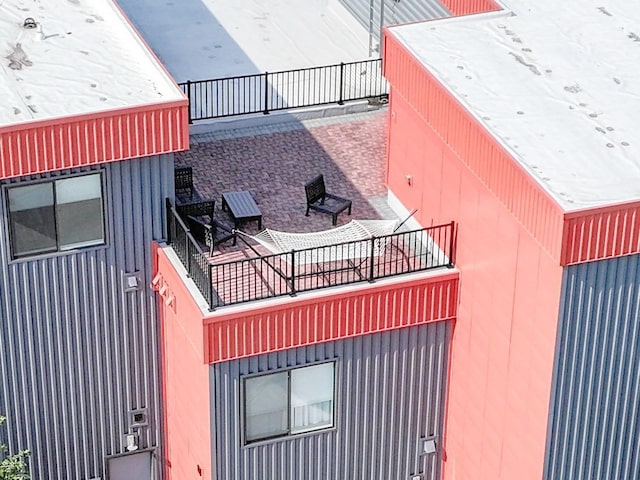 view of side of property featuring a balcony