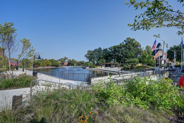 view of pool featuring a water view