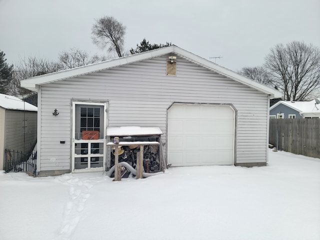 view of snow covered garage