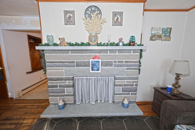 details with a baseboard heating unit, a fireplace, and wood-type flooring