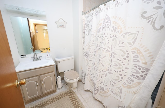 bathroom featuring toilet, tile patterned floors, a shower with shower curtain, and vanity