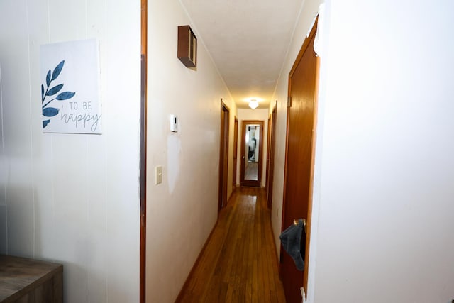 hallway featuring dark hardwood / wood-style flooring