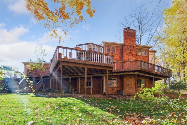 rear view of house with a deck, central air condition unit, and a lawn