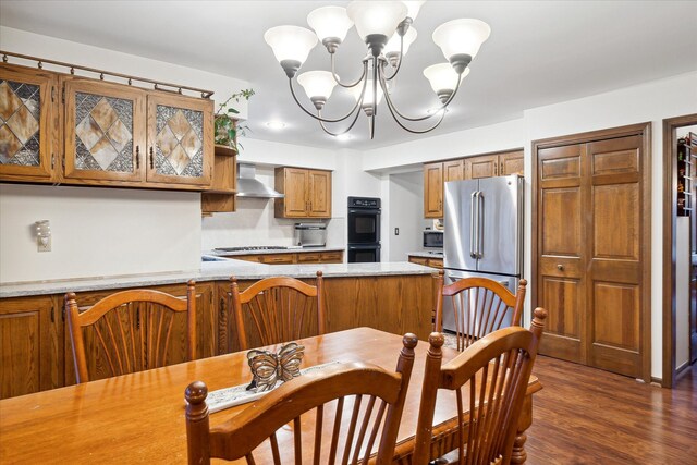 dining room with a chandelier and dark wood-type flooring