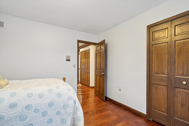 bedroom featuring dark wood-type flooring