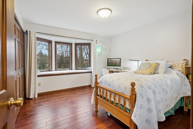 bedroom featuring dark hardwood / wood-style flooring