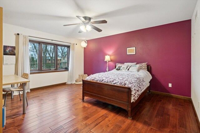 bedroom featuring ceiling fan and wood-type flooring