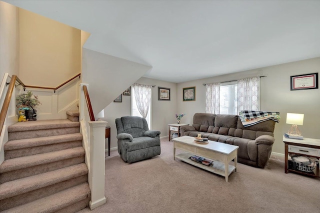 carpeted living room featuring plenty of natural light