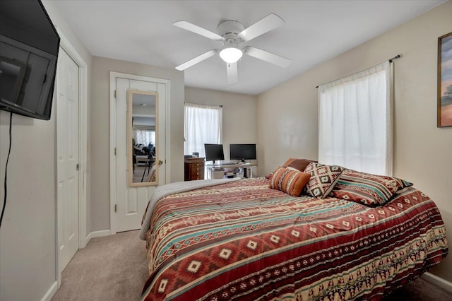 bedroom with light colored carpet and ceiling fan