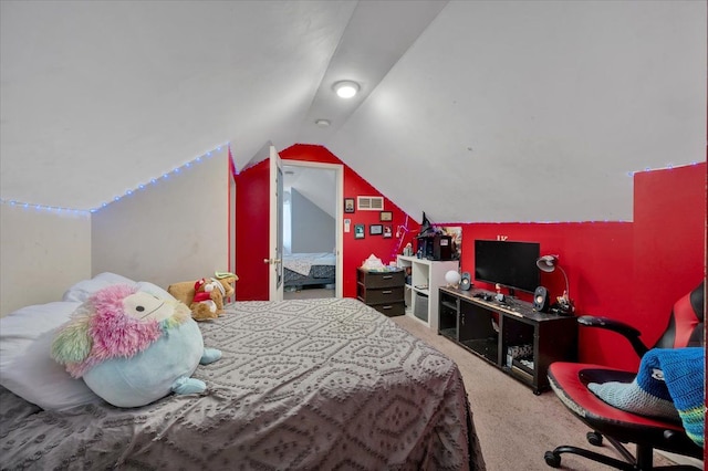 bedroom featuring vaulted ceiling and carpet