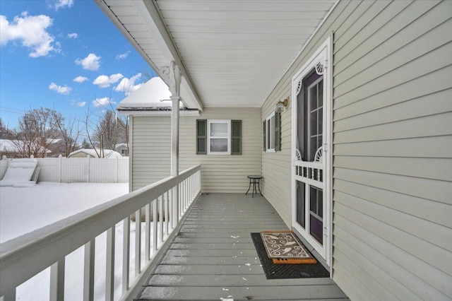 view of snow covered deck