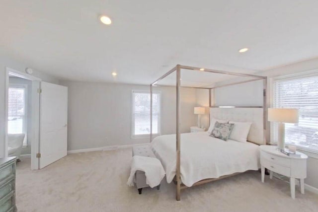 bedroom with baseboards, recessed lighting, and carpet