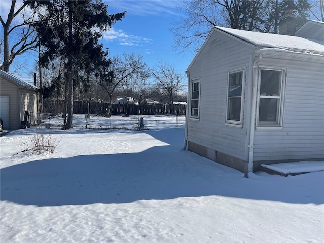 view of yard layered in snow