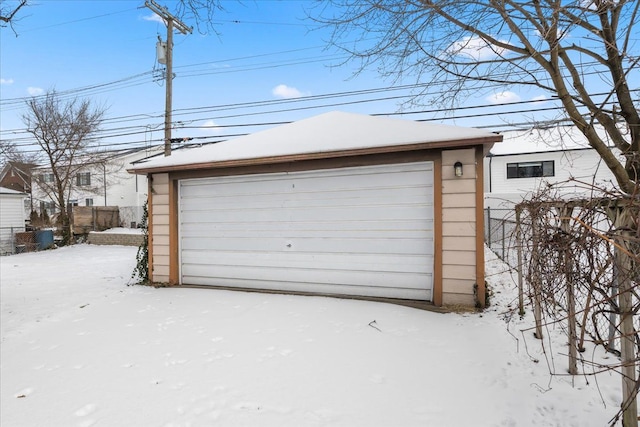 view of snow covered garage