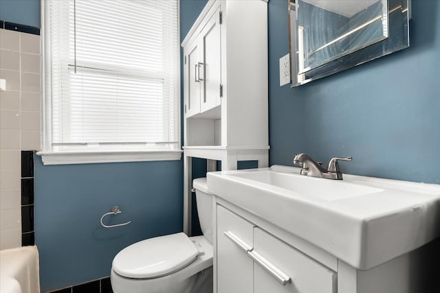 bathroom with toilet and vanity