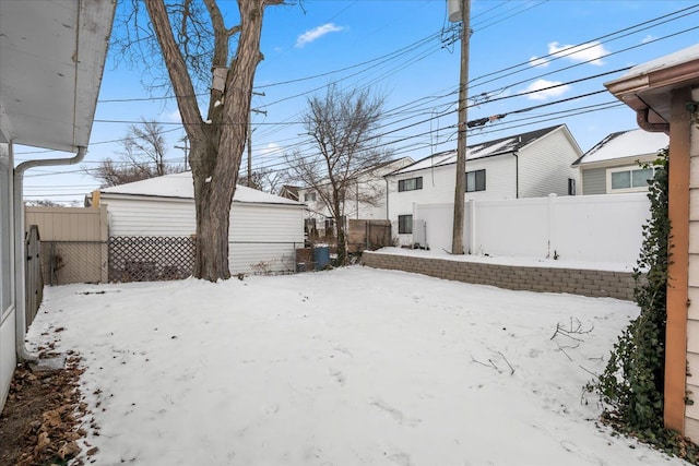 view of yard layered in snow