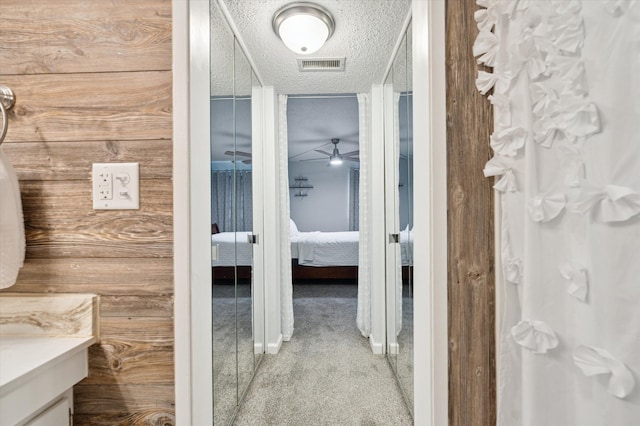 bathroom with vanity and a textured ceiling