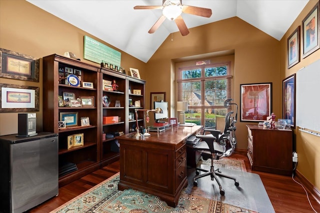 home office with ceiling fan, dark wood-type flooring, and vaulted ceiling