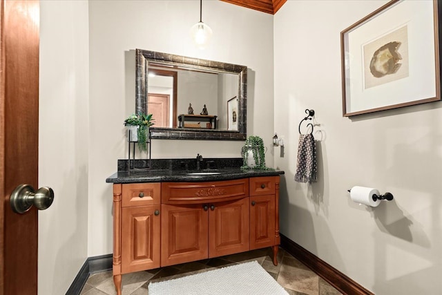 bathroom featuring ornamental molding, tile patterned floors, and vanity