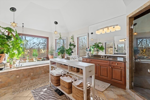 bathroom featuring high vaulted ceiling, vanity, and separate shower and tub