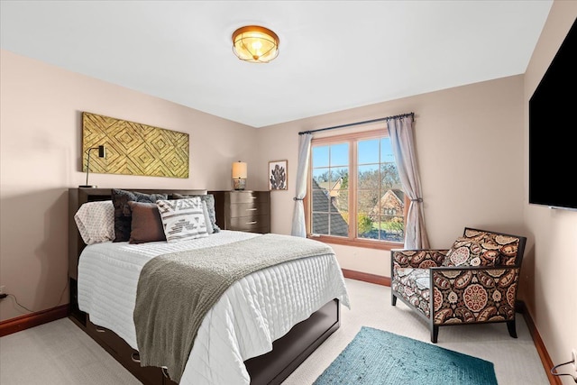 bedroom with light colored carpet