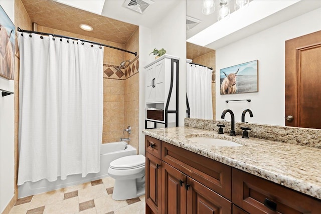 full bathroom featuring toilet, shower / tub combo, and vanity