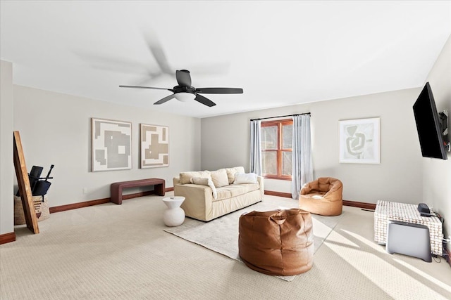 living room featuring light carpet and ceiling fan