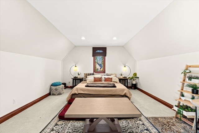 bedroom featuring carpet flooring and vaulted ceiling